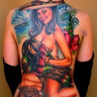 Colorful girl on beach with a little dog tattoo on back by Nikko Hurtado