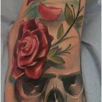 Colorful gray skull with red rose tattoo on foot