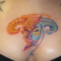 Colorful half angel half demon face tattoo on chest
