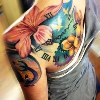 Colorful hibiscus flowers and watch tattoo on shoulder blade