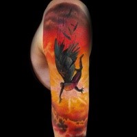 Colorful illustrative style sleeve tattoo of falling Icarus