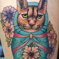 Colorful illustrative style thigh tattoo of funny wild cat doll and flower