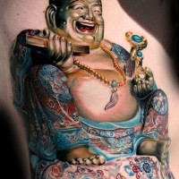 Colorful laughing god tattoo