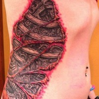 Colorful mechanisms and bones under skin rip tattoo