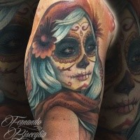 Colorful Mexican traditional shoulder tattoo of woman face with flower in hair
