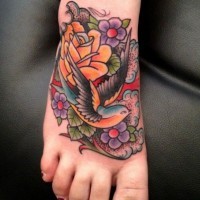 Colorful old school swallow tattoo on foot by Luke Wessman