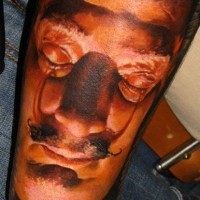 Colorful portrait of Dali forearm tattoo by denis sivak