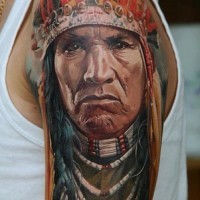 Colorful realistic native american warrior tattoo by Dmitriy Samohin