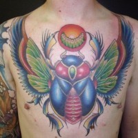 Colorful scarab with wings and larva tattoo on chest