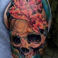 Colorful skull and a maple leaf tattoo on half sleeve