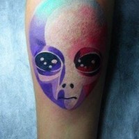 Colorful watercolor alien forearm tattoo