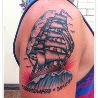 Coloured ship tattoo on shoulder
