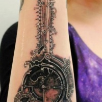 Coloured amazing clockworks forearm tattoo