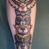 Coloured animal heads tattoo on leg