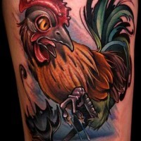 Coloured cock in rain tattoo