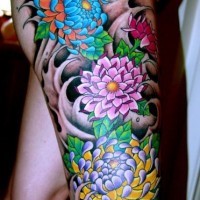 Coloured flowers tattoo on leg
