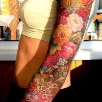 Coloured flowers tattoo on whole arm