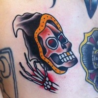 Coloured grim reaper tattoo on scapular