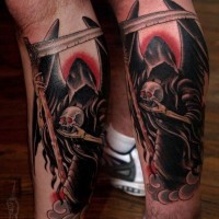 Coloured grim reaper with skull tattoo on  legs