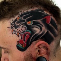 Coloured head of evil black panther tattoo on head