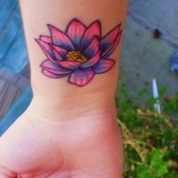 Coloured lotus flower tattoo on wrist