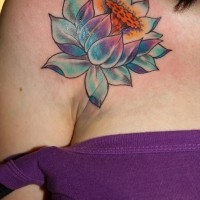 Coloured lotus tattoo on shoulder for women