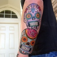 Coloured mexican sugar skull tattoo on arm