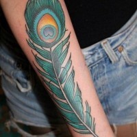Coloured green peacock feather forearm tattoo