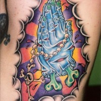 Coloured praying zombie hands tattoo on ribs