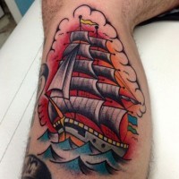 Coloured ship tattoo on leg by Stephania Cuervo