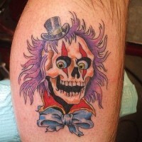 Coloured skull clown in a hat tattoo