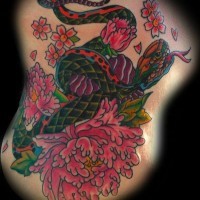 Coloured snake and pink flowers tattoo