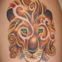 Coloured stylized lion with green eyes tattoo