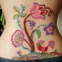 Coloured tree patchwork tattoo on lower back