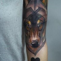 Coloured wolf head forearm tattoo