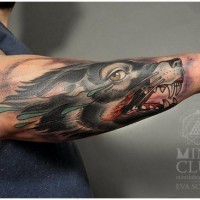 Coloured wolf with a bloody mouth forearm tattoo