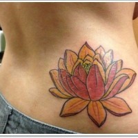 Colured lotus flower tattoo on ribs
