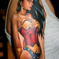 Comic books style colored detailed sexy Wounder-woman tattoo on upper arm