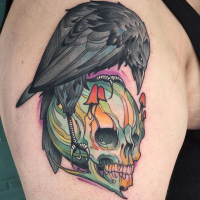 Comic books style colored upper arm tattoo of human skull with crow