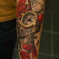 Compass with red roses and inscription forearm tattoo