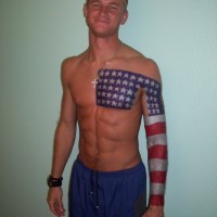 Cool american flag tattoo on chest and arm