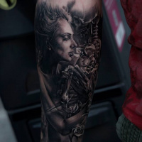 Cool black and white woman tattoo on forearm