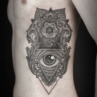 Cool black gray patterns with eye tattoo on ribs by Daniel Meyer