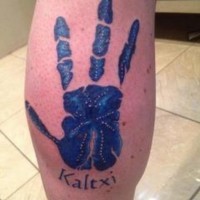 Cool blue colored arm print like tattoo on leg with lettering