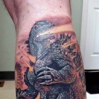 Cooler cartoonischer farbiger großer Godzilla Tattoo am Bein