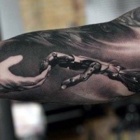 Cool colored biceps tattoo of biomechanical hand combined with human hand