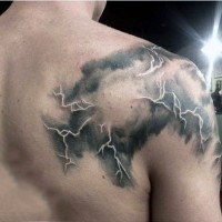 Cool colored lightning cloud tattoo on shoulder