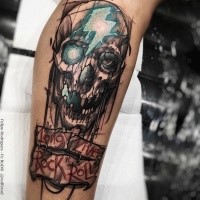 Cool colored stippling style colored leg tattoo of fantasy skull with lettering and lightning