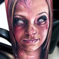 Cool detailed and colored realistic looking female zombie tattoo on arm