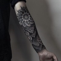 Cool gray-ink tattoo sleeve with abstract flower on forearm